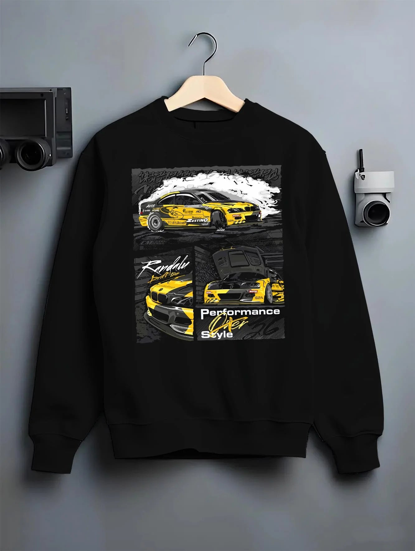Black crewneck sweatshirt on a hanger against a grey wall, featuring BMW E46 rs racing drift motorsport jdm enthusiast graphic.