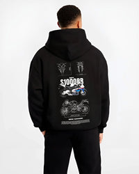 Black hoodie worn by a male model, back view, featuring BMW S1000RR racing street performance motorsport automotive graphic.
