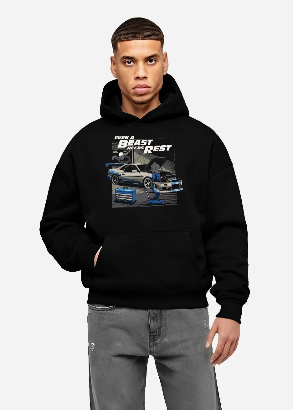 Black hoodie worn by a male model, front view, featuring racing tuner street retro beast performance motorsport automotive graphic.