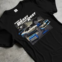 Black T-shirt laid flat with natural fabric folds, featuring racing tuner street retro beast performance motorsport graphic.