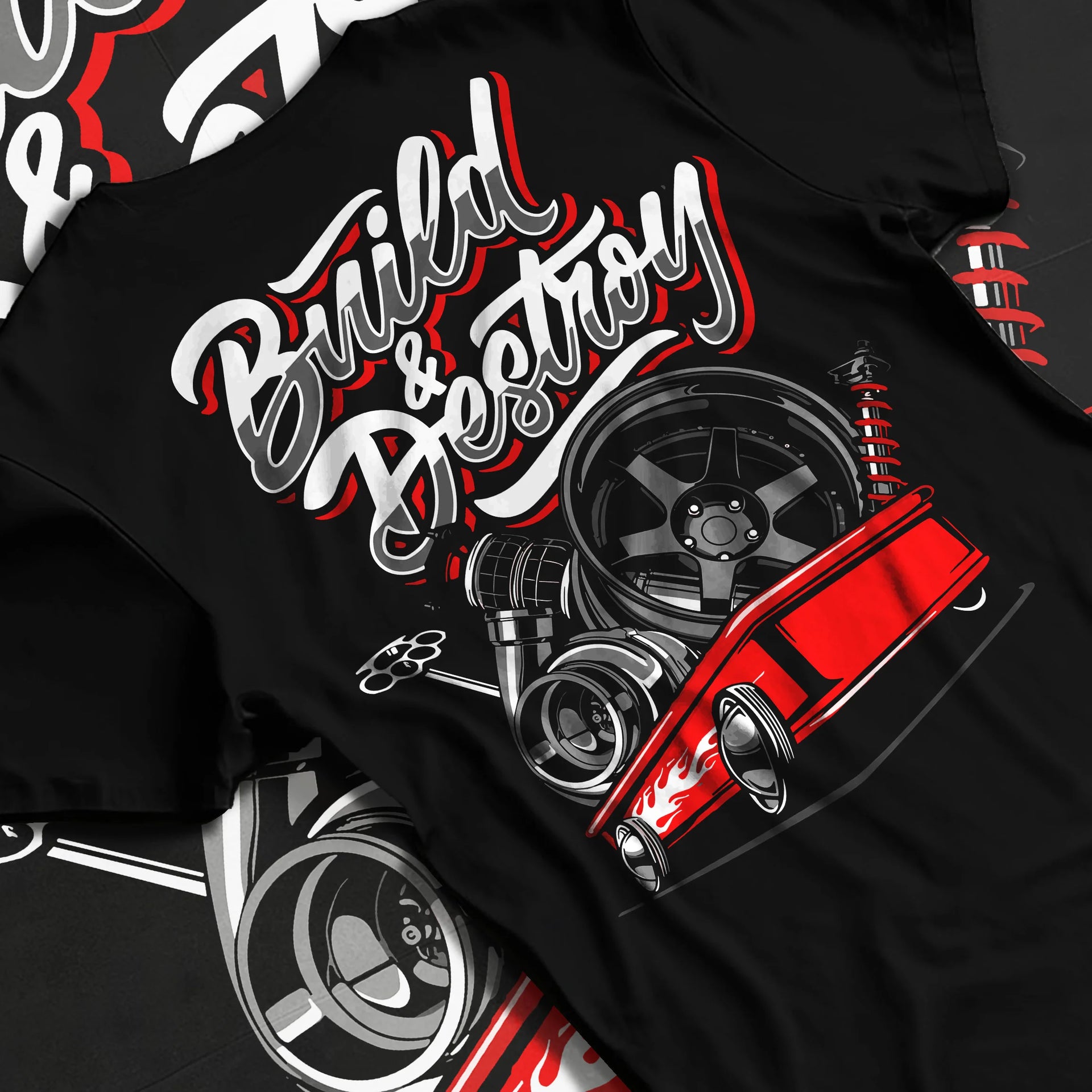 Black T-shirt laid flat with natural fabric folds, featuring racing street performance motorsport automotive enthusiast graphic.