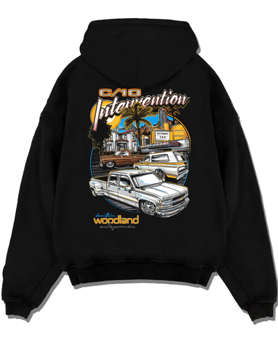 Black pullover hoodie laid flat on a white background, featuring Chevrolet C10 retro vintage classic racing street graphic.