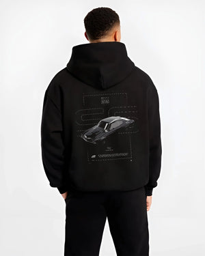 Black hoodie worn by a male model, back view, featuring Chevrolet C10 retro classic enthusiast racing street performance graphic.