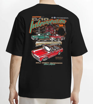 Black T-shirt worn by a male model, back view, featuring Chevrolet C10 vintage classic enthusiast meet racing street graphic.