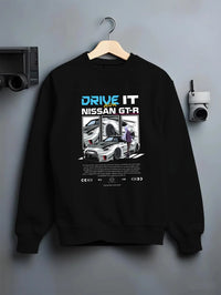 Black crewneck sweatshirt on a hanger against a grey wall, featuring muscle retro vintage classic enthusiast racing street graphic.