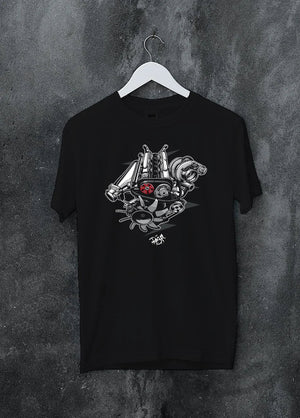 Black crewneck T-shirt on a hanger against a grey wall, featuring muscle retro vintage racing street performance motorsport graphic.