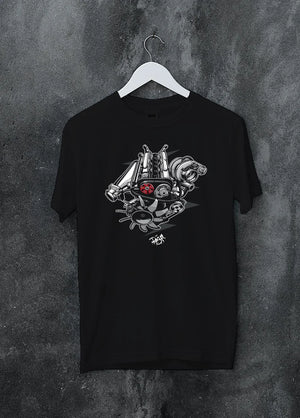 Black crewneck T-shirt on a hanger against a grey wall, featuring muscle retro vintage racing street performance motorsport graphic.