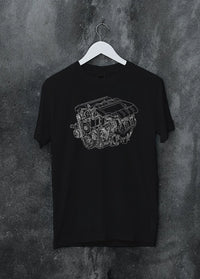 Black crewneck T-shirt on a hanger against a grey wall, featuring street enthusiast racing performance motorsport graphic.