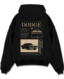 Black pullover hoodie laid flat on a white background, featuring Dodge Charger muscle street retro vintage enthusiast graphic.