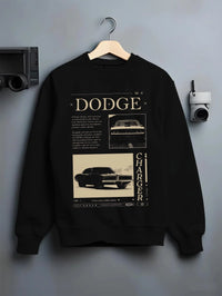 Black crewneck sweatshirt on a hanger against a grey wall, featuring Dodge Charger muscle street retro vintage enthusiast graphic.