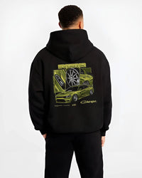Black hoodie worn by a male model, back view, featuring Dodge Charger racing jdm american muscle street retro graphic.