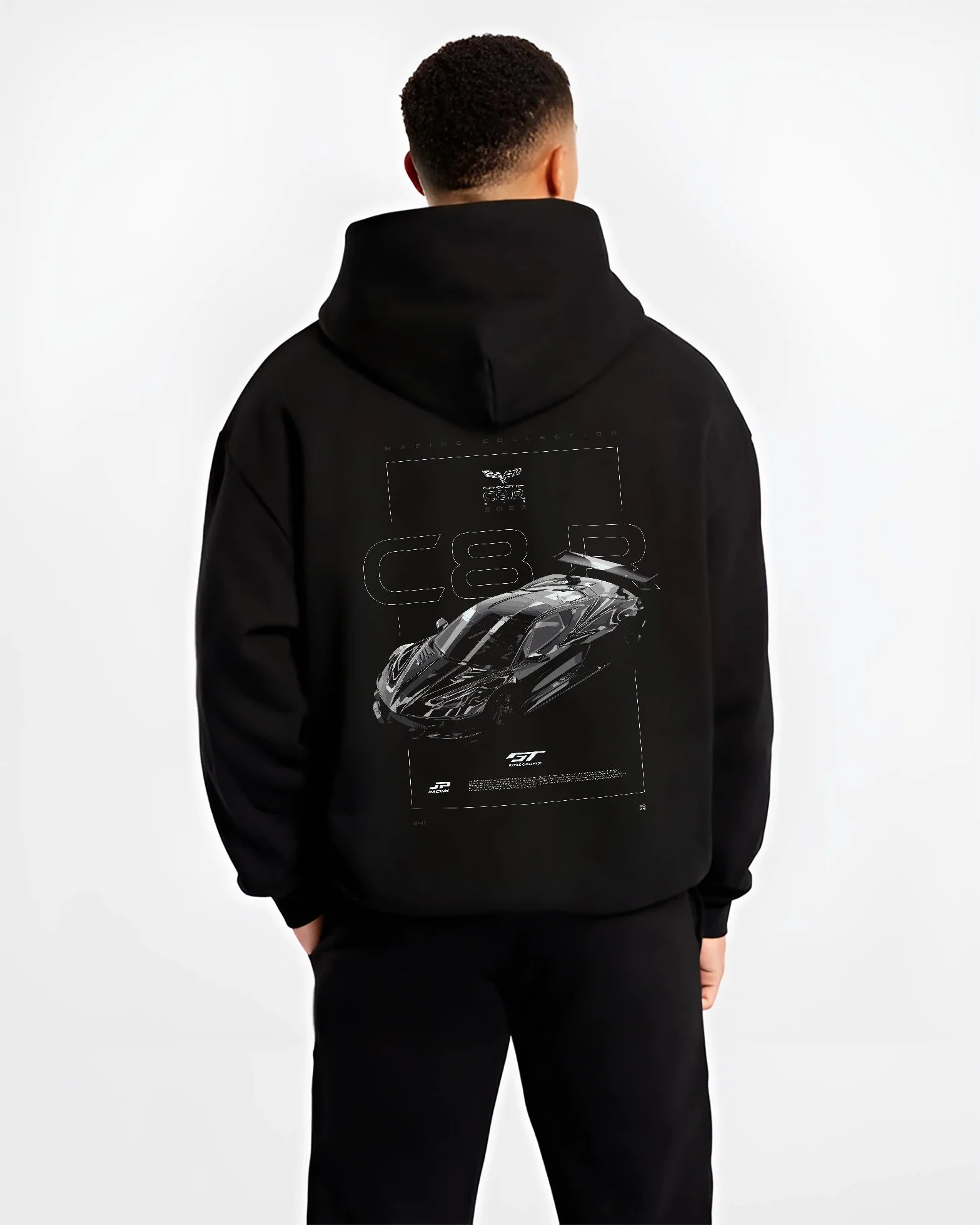 Black hoodie worn by a male model, back view, featuring Chevrolet Corvette C8 corvette racing american muscle street retro graphic.