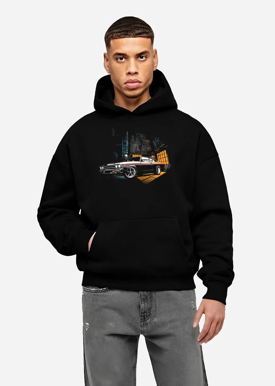 Black hoodie worn by a male model, front view, featuring Chevrolet Chevelle rs american muscle retro classic enthusiast graphic.