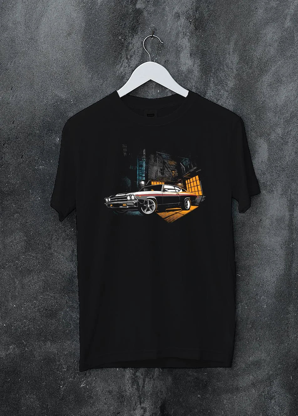 Black crewneck T-shirt on a hanger against a grey wall, featuring Chevrolet Chevelle rs american muscle retro classic graphic.