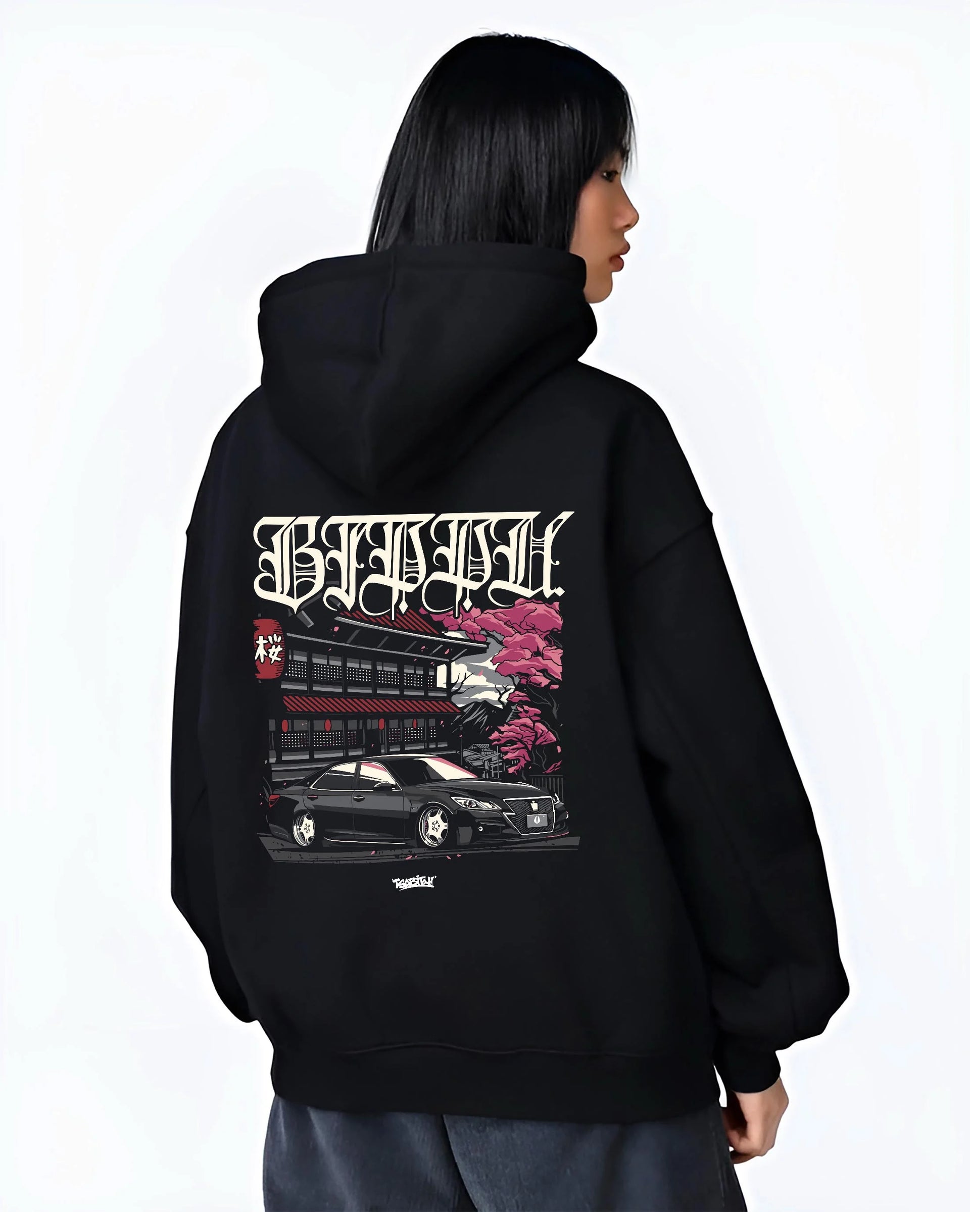 Black hoodie worn by a female model, back view, featuring Toyota rs race drift jdm japanese street racing graphic.