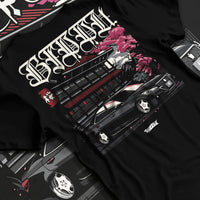 Black T-shirt laid flat with natural fabric folds, featuring Toyota rs race drift jdm japanese street racing graphic.