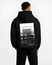 Black hoodie worn by a male model, back view, featuring Dodge Challenger american muscle street retro classic legend graphic.