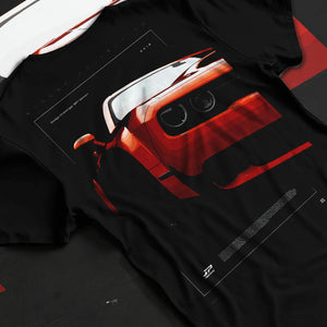 Black T-shirt laid flat with natural fabric folds, featuring Dodge Challenger srt racing muscle street enthusiast graphic.