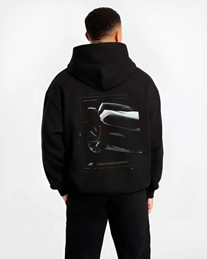 Black hoodie worn by a male model, back view, featuring Dodge Charger racing muscle street enthusiast performance graphic.