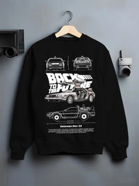 Black crewneck sweatshirt on a hanger against a grey wall, featuring DeLorean DMC-12 street retro racing performance dmcbtf.
