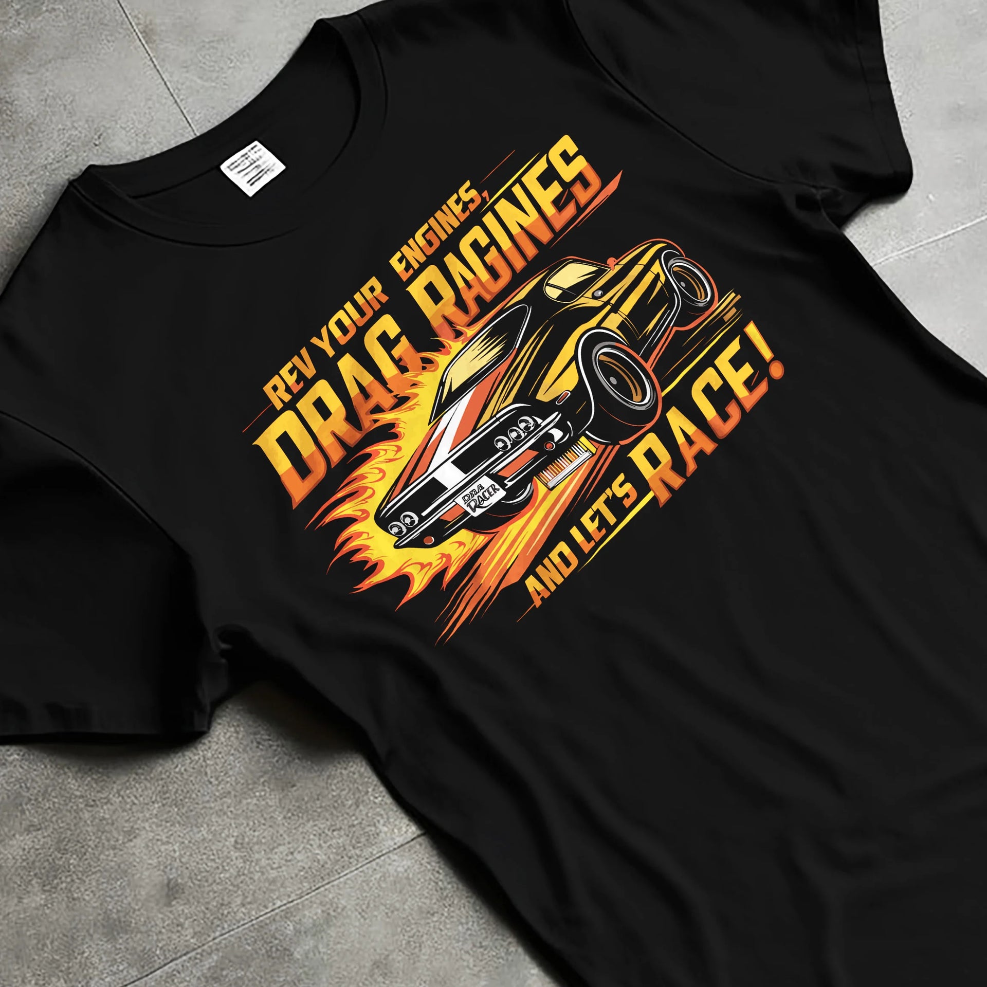 Black T-shirt laid flat with natural fabric folds, featuring turbo racing drag muscle street retro performance motorsport graphic.
