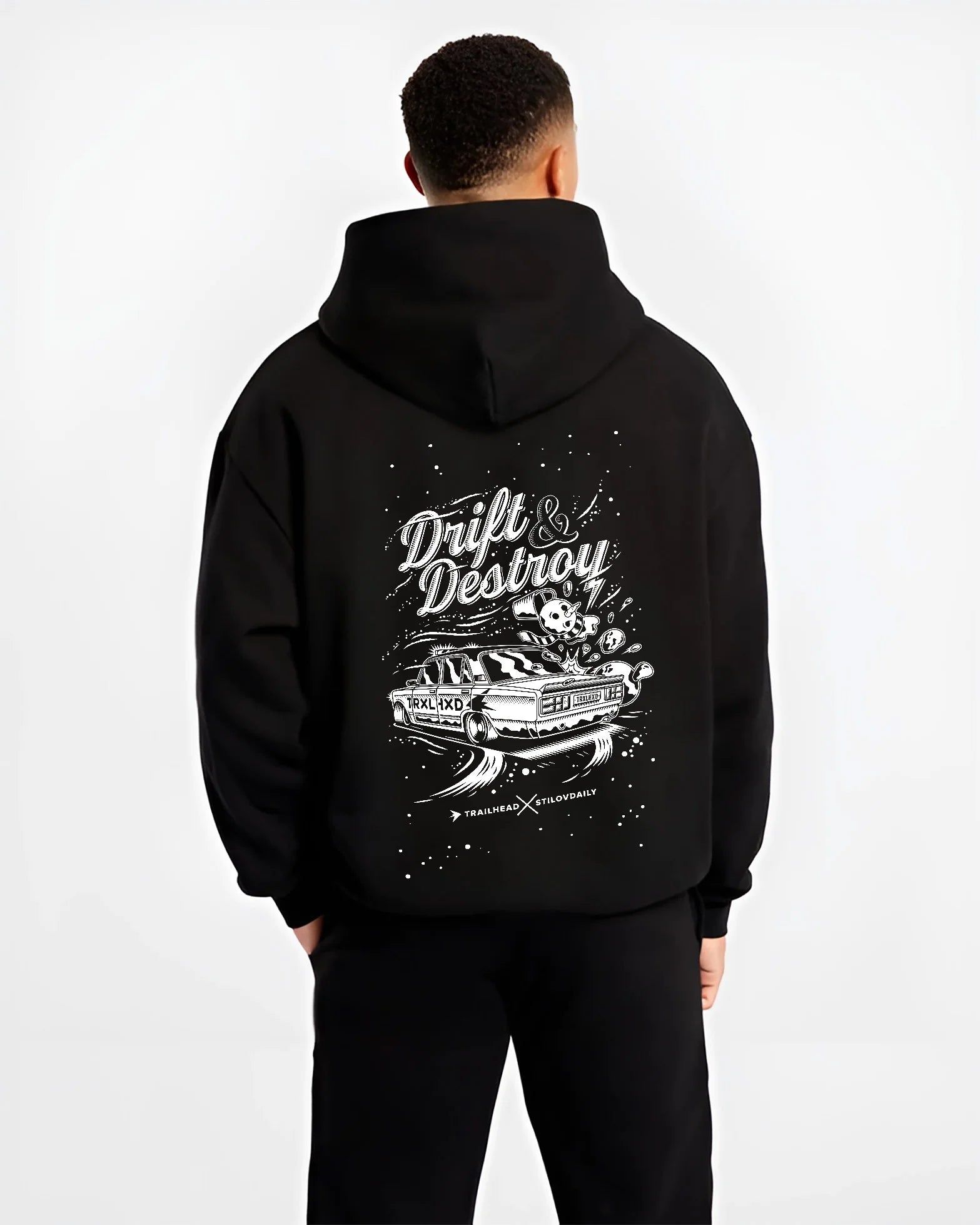 Black hoodie worn by a male model, back view, featuring racing drift street retro performance motorsport automotive graphic.
