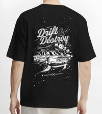 Black T-shirt worn by a male model, back view, featuring racing drift street retro performance motorsport automotive graphic.