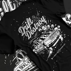 Black T-shirt laid flat with natural fabric folds, featuring racing drift street retro performance motorsport automotive graphic.