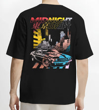 Black T-shirt worn by a male model, back view, featuring racing drift jdm japanese muscle tokyo street midnight tokyo drift graphic.