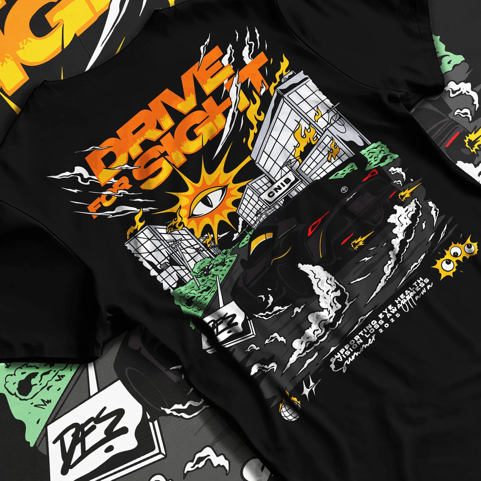 Black T-shirt laid flat with natural fabric folds, featuring racing drift street performance motorsport automotive graphic.