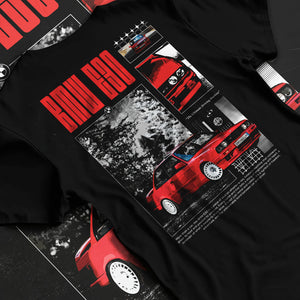 Black T-shirt laid flat with natural fabric folds, featuring BMW rs turbo racing drift motorsport euro german street retro graphic.