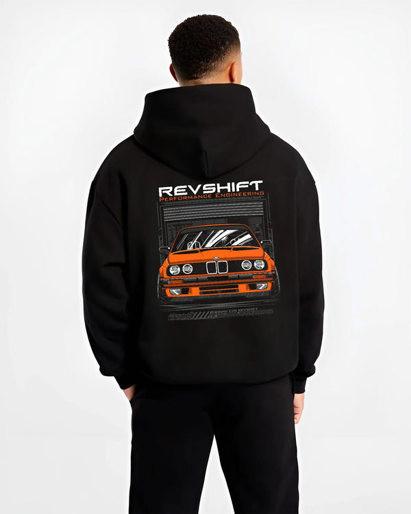 Black hoodie worn by a male model, back view, featuring BMW E30 rs motorsport street vintage classic racing graphic.