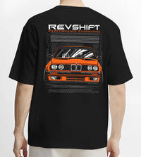 Black T-shirt worn by a male model, back view, featuring BMW E30 rs motorsport street vintage classic racing graphic.