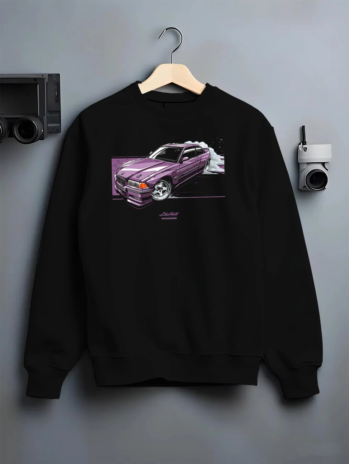 Black crewneck sweatshirt on a hanger against a grey wall, featuring BMW E36 rs turbo racing drift motorsport jdm euro graphic.
