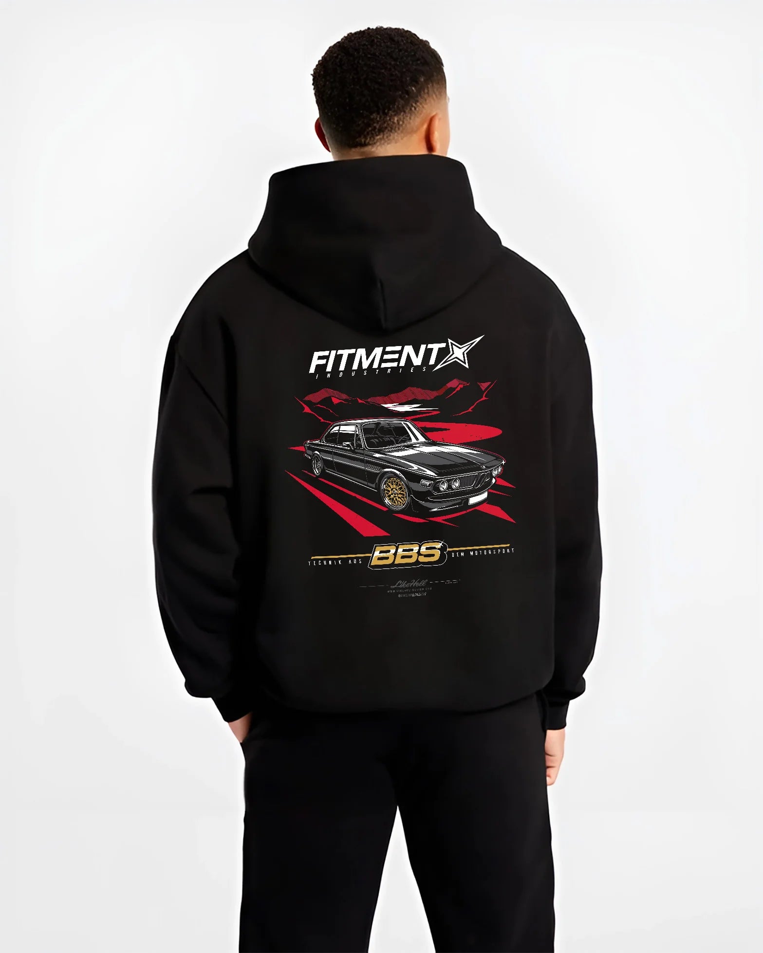 Black hoodie worn by a male model, back view, featuring BMW rs turbo ls racing motorsport euro street retro classic graphic.