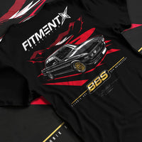 Black T-shirt laid flat with natural fabric folds, featuring BMW rs turbo ls racing motorsport euro street retro classic graphic.