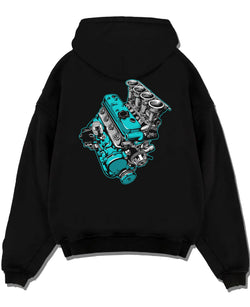 Black pullover hoodie laid flat on a white background, featuring tuning racing street performance motorsport automotive graphic.