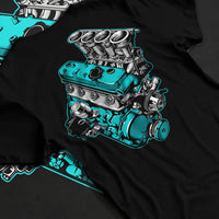 Black T-shirt laid flat with natural fabric folds, featuring tuning racing street performance motorsport automotive graphic.