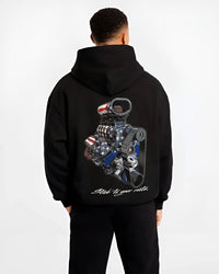 Black hoodie worn by a male model, back view, featuring v8 american muscle retro classic enthusiast racing street graphic.