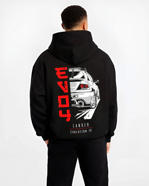 Black hoodie worn by a male model, back view, featuring Mitsubishi EVO turbo racing drift track jdm street enthusiast graphic.