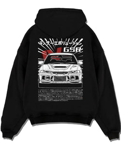 Black pullover hoodie laid flat on a white background, featuring Mitsubishi EVO lancer turbo racing drift jdm japanese graphic.