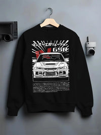 Black crewneck sweatshirt on a hanger against a grey wall, featuring Mitsubishi EVO lancer turbo racing drift jdm japanese graphic.