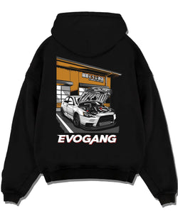 Black pullover hoodie laid flat on a white background, featuring Mitsubishi EVO rs racing jdm tuner street performance graphic.