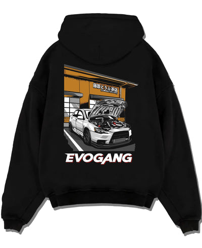 Black pullover hoodie laid flat on a white background, featuring Mitsubishi EVO rs racing jdm tuner street performance graphic.