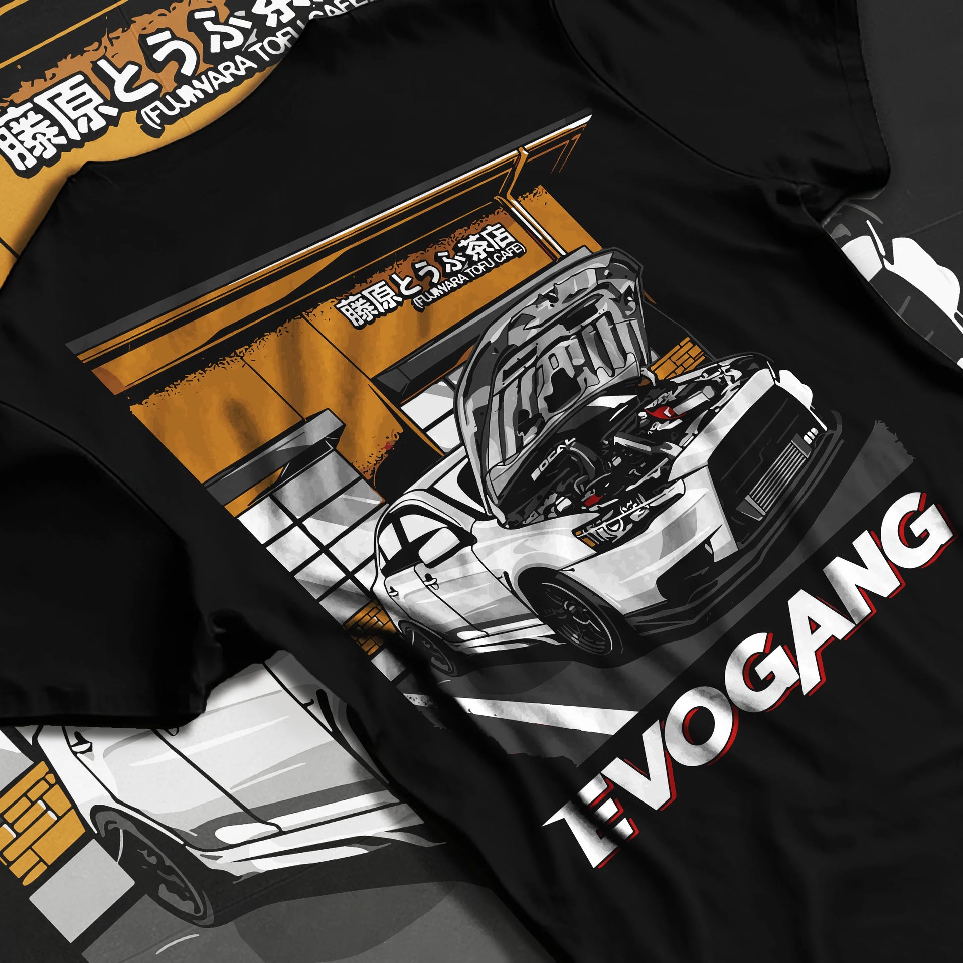 Black T-shirt laid flat with natural fabric folds, featuring Mitsubishi EVO rs racing jdm tuner street performance graphic.