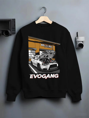 Black crewneck sweatshirt on a hanger against a grey wall, featuring Mitsubishi EVO rs racing jdm tuner street performance graphic.