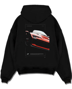 Black pullover hoodie laid flat on a white background, featuring Ferrari SF90 racing street performance motorsport graphic.