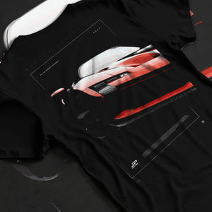 Black T-shirt laid flat with natural fabric folds, featuring Ferrari SF90 racing street performance motorsport automotive graphic.