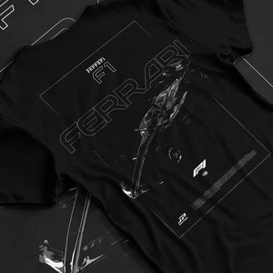 Black T-shirt laid flat with natural fabric folds, featuring Ferrari rs racing f1 formula motorsport street performance graphic.