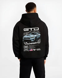 Black hoodie worn by a male model, back view, featuring MUSTANG supercharged v8 racing american muscle street power graphic.